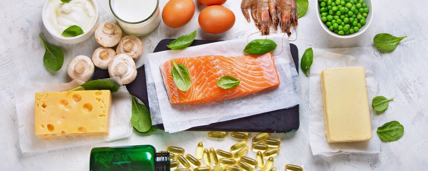 An assortment of foods rich in vitamin D, including fatty fish such as salmon, mackerel, and sardines, fortified dairy products like milk and yogurt, egg yolks, and mushrooms. These foods are excellent dietary sources of vitamin D, which contributes to overall health and well-being.